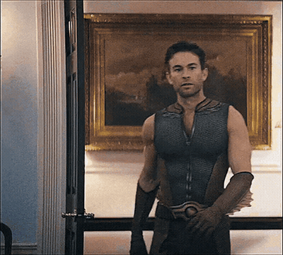 Superhero Man In Front Of Painting GIF