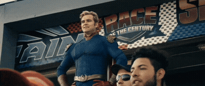 Superhero Man In Front Of Race Sign GIF
