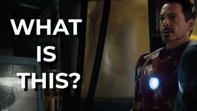 Superhero Man In Front Of Screen Saying What Is This GIF