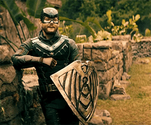 Superhero Man Leaning On Wall With Shield GIF