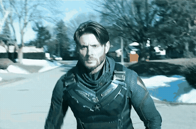 Superhero Man Walking On Snowy Street GIF