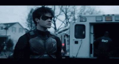 Superhero Standing In Front Of Ambulance GIF