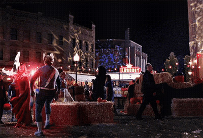 Superhero Standing In Front Of Knorry Theater GIF