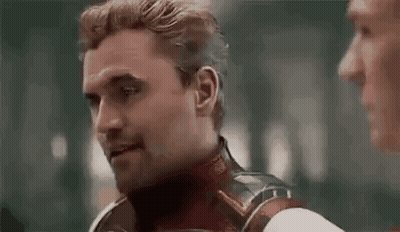 Superhero Talking To Man In Dark Room GIF