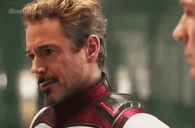 Superhero Talking To Man In Room GIF