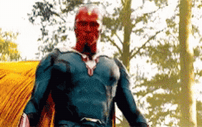 Superhero With Red Face Standing In Woods GIF