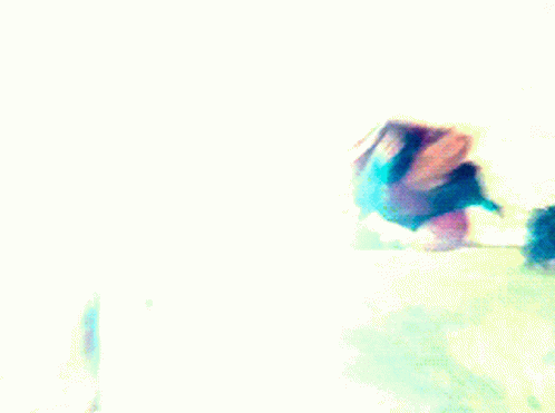 Superman And Flash Are Flying Over A Road In A Field . GIF