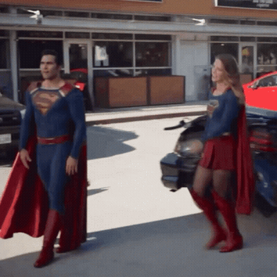 Superman And Supergirl Standing Together GIF