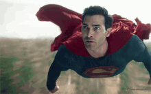 Superman Flying Over A Field