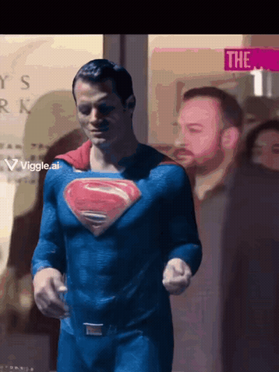 Superman in Front of Sign Saying The 1