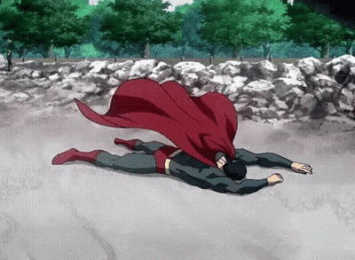 Superman Laying On Ground With Red Cape GIF