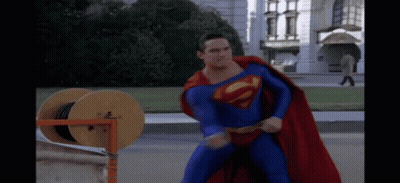 Superman Lying On Ground With Hands Up GIF