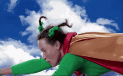 Superwoman Flying With Crazy Hair GIF