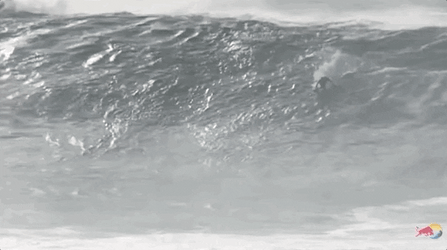 Surfing Through Monster Blue Wave GIF