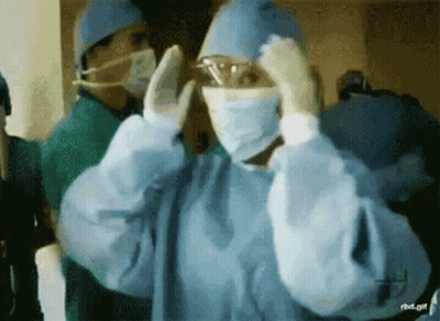Surgeon In Mask And Goggles Getting Ready GIF