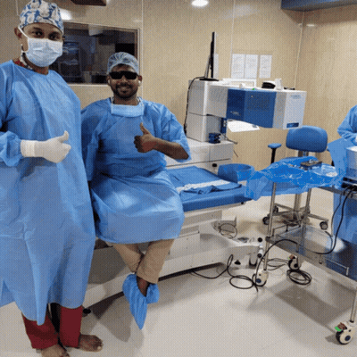 Surgeon Thumbs Up, Another On Operating Table GIF