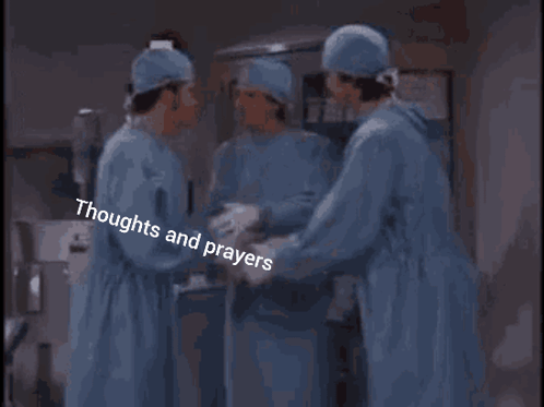 Surgeons Standing In Operating Room GIF