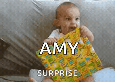 Surprised Baby Holding Gift For Amy GIF