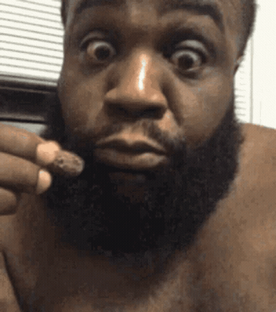 Surprised Bearded Man Holding Something GIF