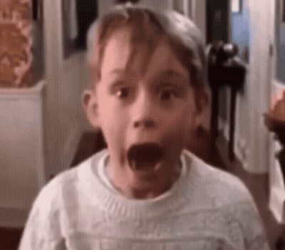 Surprised Boy In White Sweater GIF