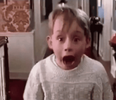 Surprised Boy In White Sweater GIF