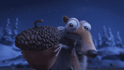 Surprised Cartoon Character Laying On Rock GIF