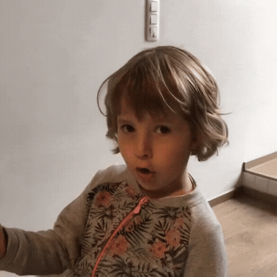 Surprised Little Girl In Floral Sweatshirt GIF