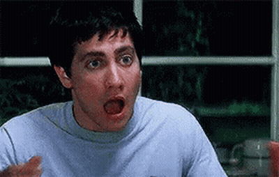 Surprised Man At Table GIF