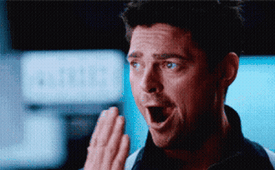 Surprised Man Covering Mouth GIF