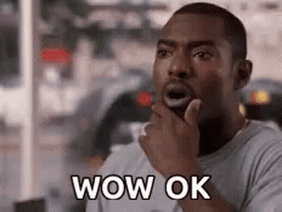 Surprised Man Holding Hand To Chin GIF
