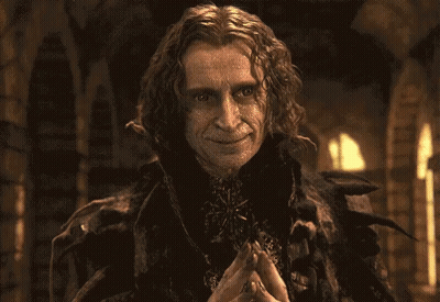 Surprised Man Holding Hands To Chest GIF