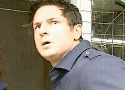 Surprised Man In Blue Shirt GIF
