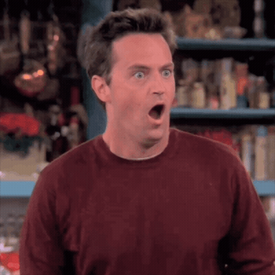 Surprised Man In Maroon Sweater GIF