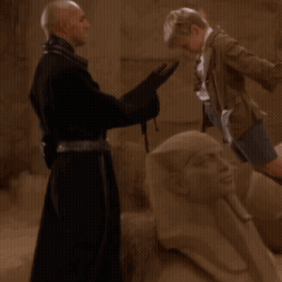 Surprised Man Speaking To Jar GIF