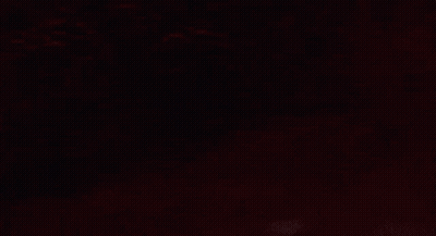 Surprised Man Standing In Dark GIF