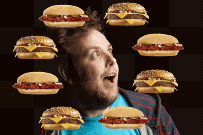Surprised Man Surrounded By Hamburgers GIF