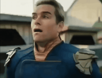 Surprised Superhero Man Holding Tablet GIF