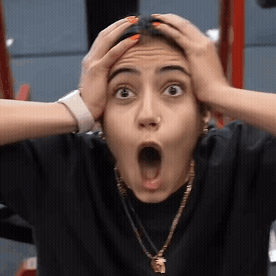 Surprised Woman Holding Head GIF
