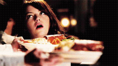 Surprised Woman Holding Plate Of Food GIF