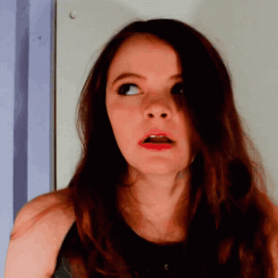 Surprised Woman In Black Tank Top GIF