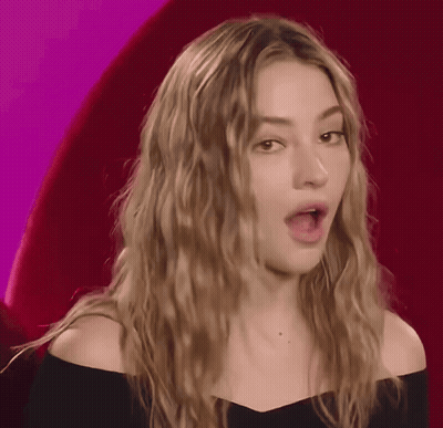 Surprised Woman In Black Top GIF