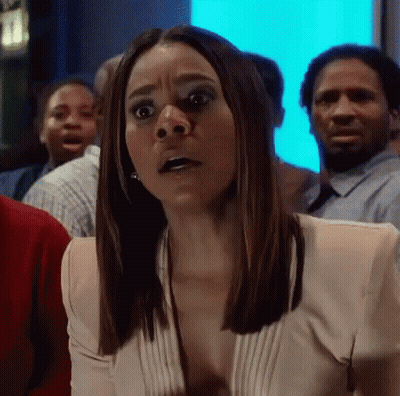 Surprised Woman In Crowd GIF