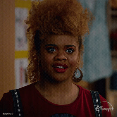 Surprised Woman in Disney+ Shirt