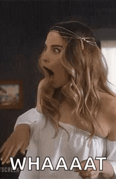 Surprised Woman In Off-Shoulder Top And Headband GIF