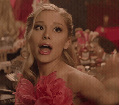 Surprised Woman In Pink Dress With Flower GIF