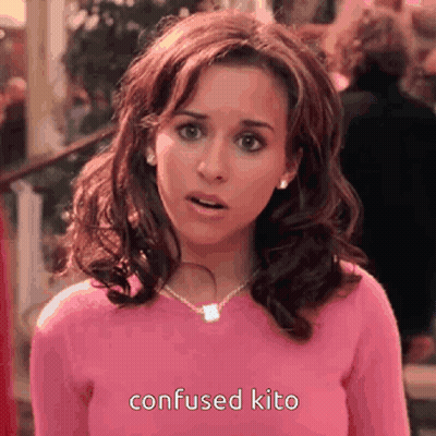 Surprised Woman In Pink Sweater And Necklace GIF
