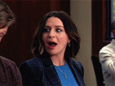 Surprised Woman Next To Man GIF
