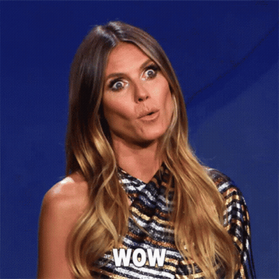Surprised Woman Wearing Wow Shirt GIF