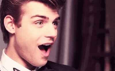 Surprised Young Man In Suit And Bow Tie GIF