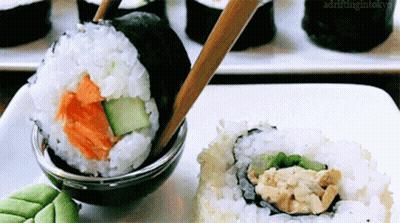 Sushi Plate With Chopsticks And Soy Sauce Drifting In Tokyo GIF